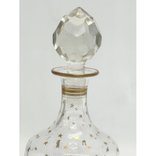 72 - An Early 20th Century French gilt star glass decanter. Circa 1900-1920. 22.5cm