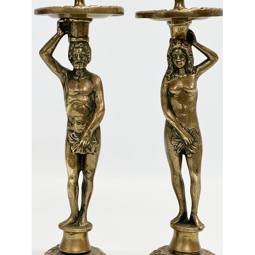 80 - A pair of 19th Century Victorian brass ‘Adam and Eve’ candlesticks. 28cm