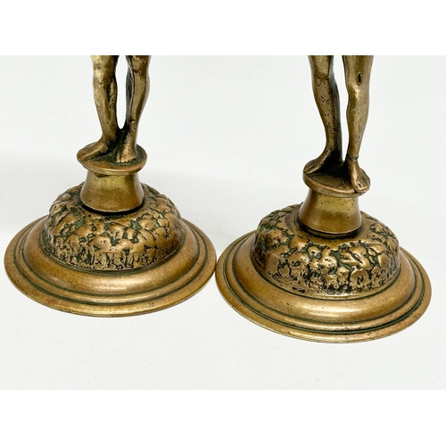 80 - A pair of 19th Century Victorian brass ‘Adam and Eve’ candlesticks. 28cm