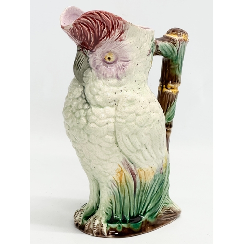 82 - A Late 19th Century Majolica parrot jug. 19x23cm