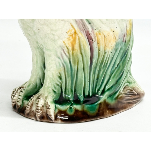 82 - A Late 19th Century Majolica parrot jug. 19x23cm