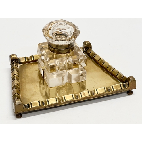 42 - A Victorian pen and ink stand. Cut glass inkwell on brass stand. 19x14x11cm