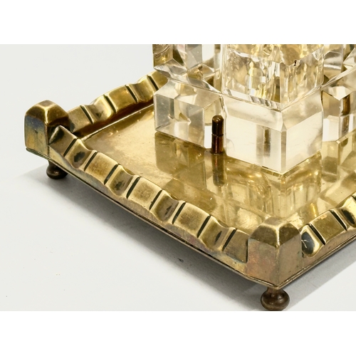 42 - A Victorian pen and ink stand. Cut glass inkwell on brass stand. 19x14x11cm