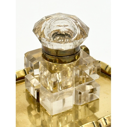 42 - A Victorian pen and ink stand. Cut glass inkwell on brass stand. 19x14x11cm