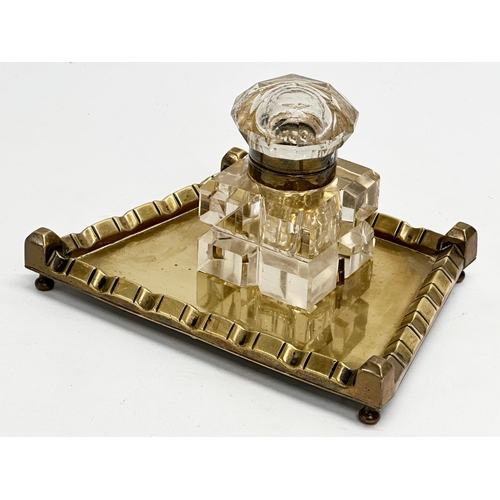 42 - A Victorian pen and ink stand. Cut glass inkwell on brass stand. 19x14x11cm