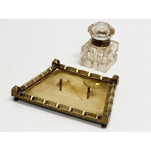 42 - A Victorian pen and ink stand. Cut glass inkwell on brass stand. 19x14x11cm