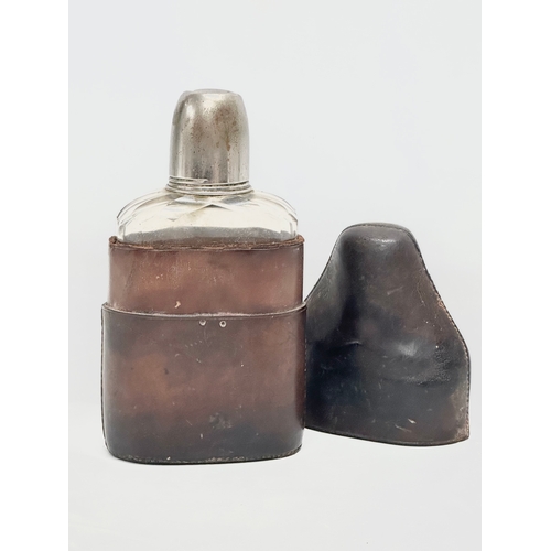 91 - A Late 19th Century Victorian hip flask with leather case. 17.5cm