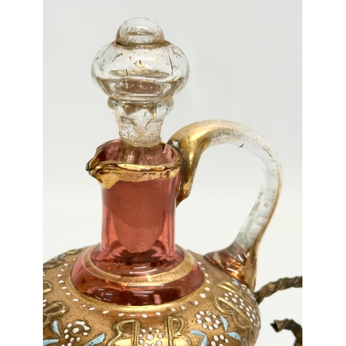 5 - An Early 19th Century French gilt cranberry glass decanter with original gilt brass holder and dropl... 