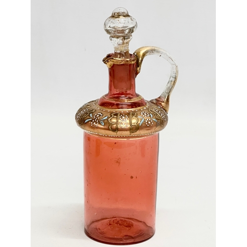 5 - An Early 19th Century French gilt cranberry glass decanter with original gilt brass holder and dropl... 