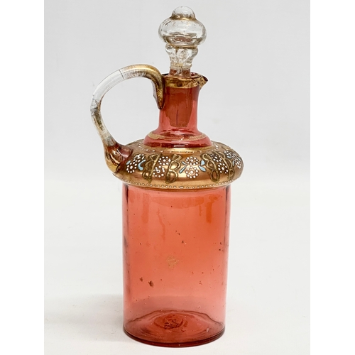 5 - An Early 19th Century French gilt cranberry glass decanter with original gilt brass holder and dropl... 