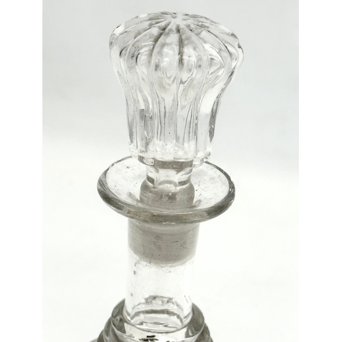 106 - An Early 19th Century bell shaped 3 ring decanter. Circa 1820. 22cm