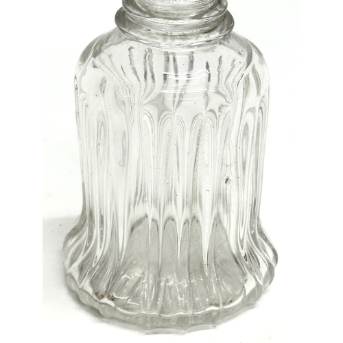 106 - An Early 19th Century bell shaped 3 ring decanter. Circa 1820. 22cm