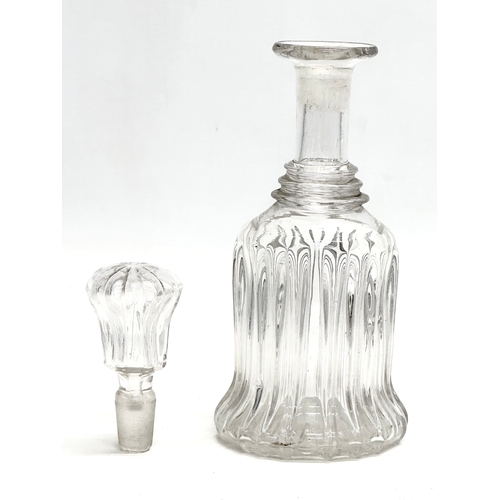 106 - An Early 19th Century bell shaped 3 ring decanter. Circa 1820. 22cm