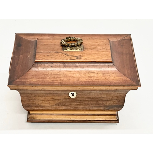 98 - A Regency rosewood sarcophagus jewellery box with Mother of Pearl escutcheon and brass ring handle. ... 