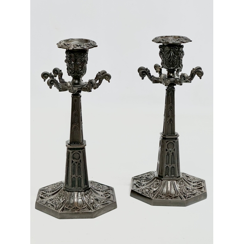 12 - A pair of good quality Mid 19th Century Gothic style candlesticks. 12x12x24cm