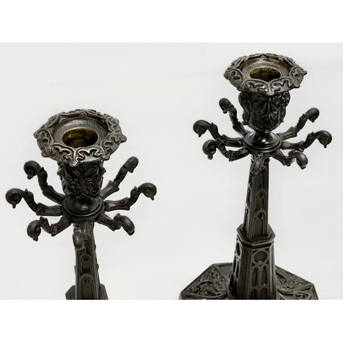 12 - A pair of good quality Mid 19th Century Gothic style candlesticks. 12x12x24cm