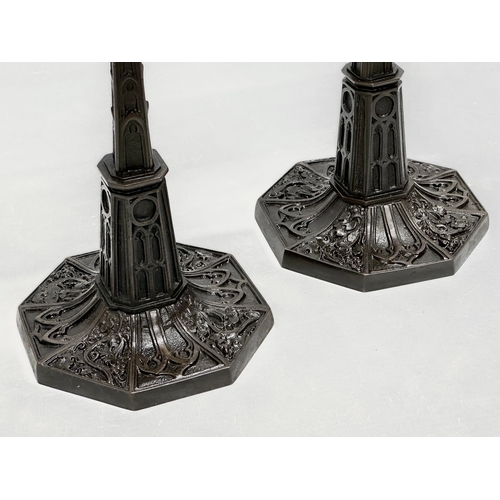 12 - A pair of good quality Mid 19th Century Gothic style candlesticks. 12x12x24cm