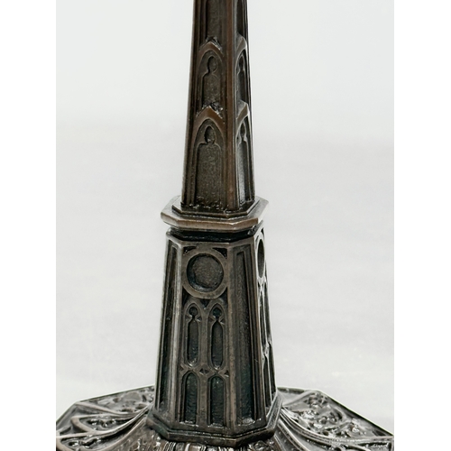 12 - A pair of good quality Mid 19th Century Gothic style candlesticks. 12x12x24cm