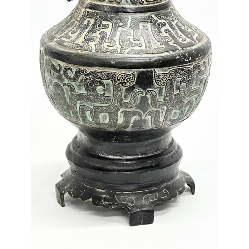 116 - A large 19th Century Chinese bronze pot with lid. 34cm