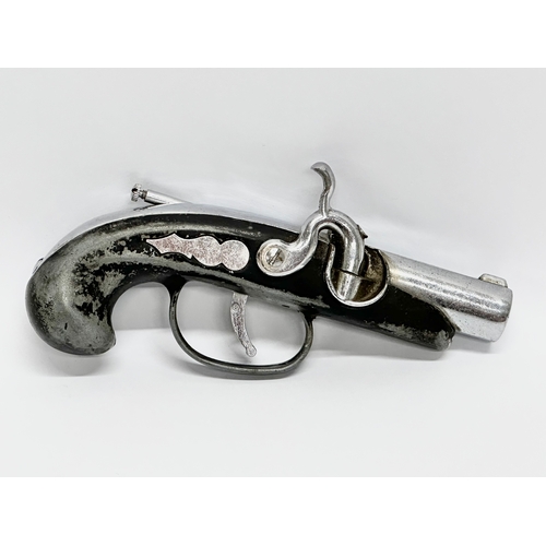 406 - A 20th Century flintlock lighter pistol. 14cm