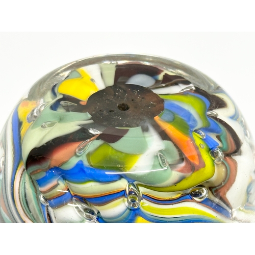 412 - A large Mid 20th Century hand blown glass paperweight. 12cm