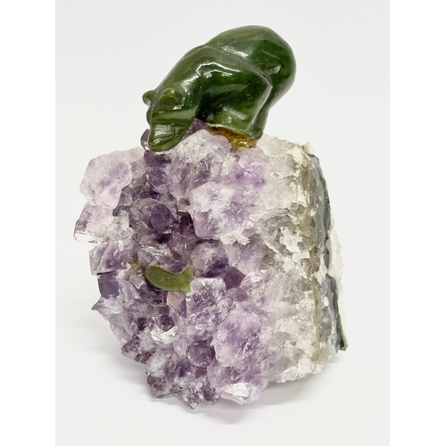 407 - A Jade bear and salmon on carved amethyst base. 8x11cm