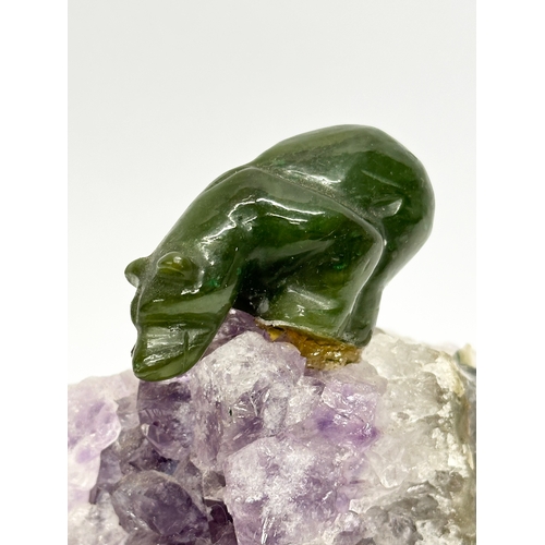 407 - A Jade bear and salmon on carved amethyst base. 8x11cm