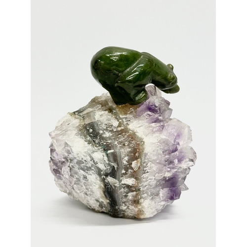 407 - A Jade bear and salmon on carved amethyst base. 8x11cm