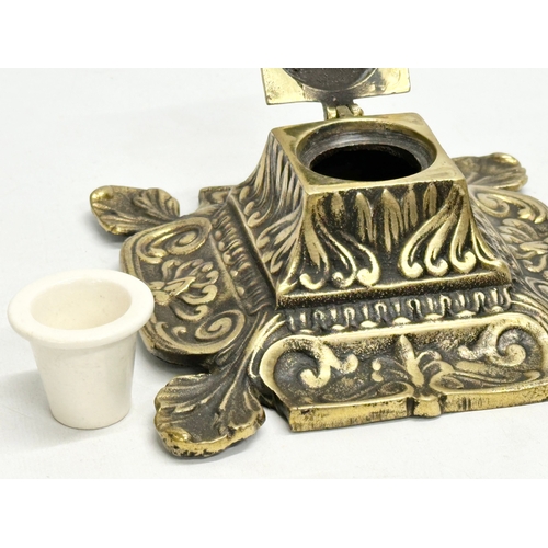 130 - A large Victorian brass inkstand with original stoneware liner. 16x16x7cm