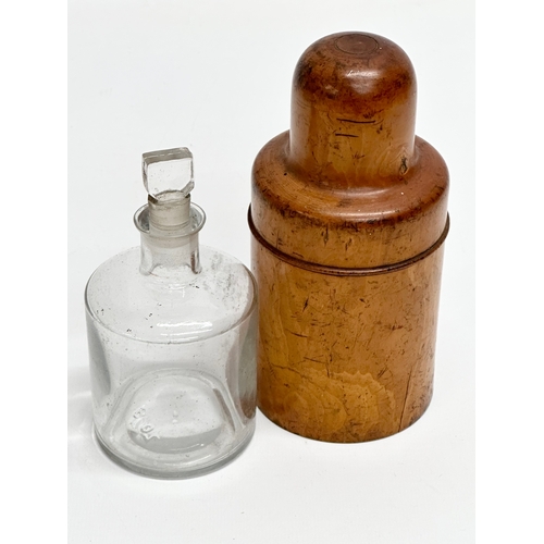 134 - A 19th Century Victorian medicine bottle in wooden treen case. 16cm