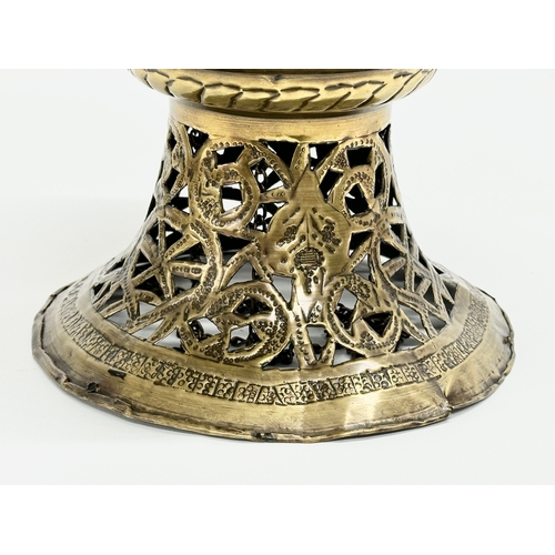 8 - An Early 20th Century Moroccan pierced brass Mosque ceiling light. Circa 1900.  21x34cm. 63cm includ... 