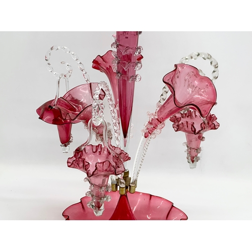 14 - A large Victorian cranberry glass epergne. 36x60cm