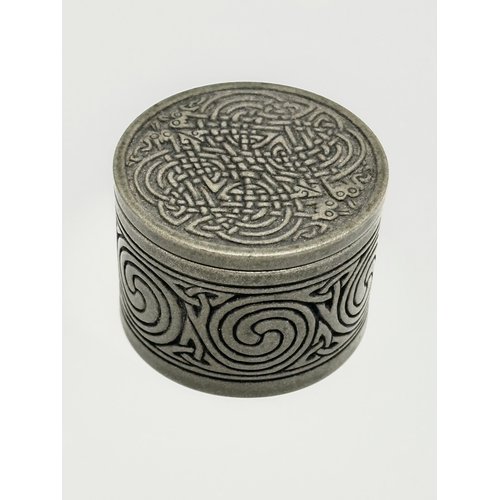 414 - A Celtic pewter pill box. 5x3.5cm