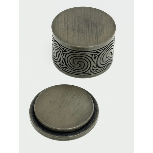 414 - A Celtic pewter pill box. 5x3.5cm