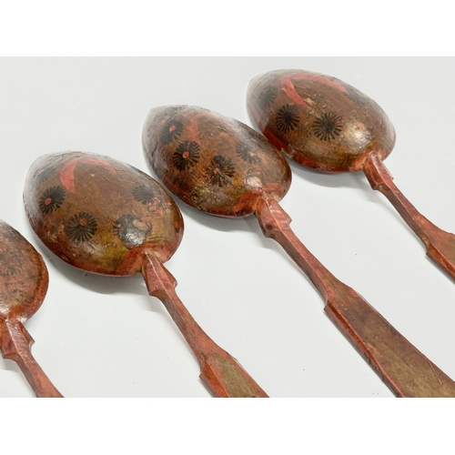 51 - A set of 6 19th Century Folk Art hand painted treen ware spoons. Probably Russian. 21cm