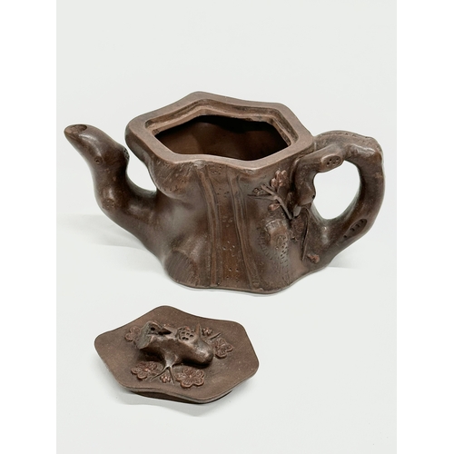 118 - An Early 20th Century Yixing clay ‘tree stump’ teapot with cover. Impressed seal mark. 17x9x8.5cm