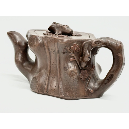 118 - An Early 20th Century Yixing clay ‘tree stump’ teapot with cover. Impressed seal mark. 17x9x8.5cm