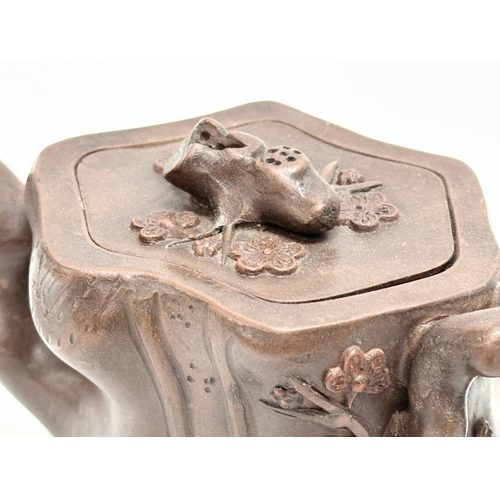 118 - An Early 20th Century Yixing clay ‘tree stump’ teapot with cover. Impressed seal mark. 17x9x8.5cm