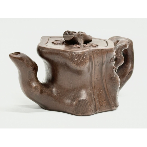 118 - An Early 20th Century Yixing clay ‘tree stump’ teapot with cover. Impressed seal mark. 17x9x8.5cm