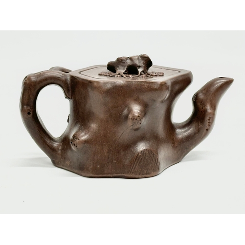 118 - An Early 20th Century Yixing clay ‘tree stump’ teapot with cover. Impressed seal mark. 17x9x8.5cm