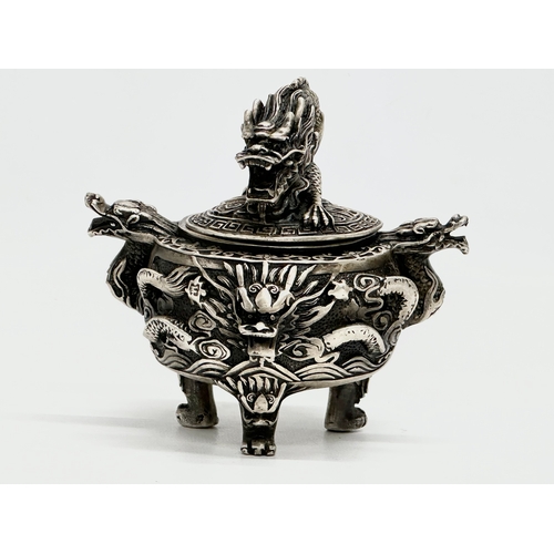 52 - An Early 20th Century Chinese Tibetan ‘9 dragon’ incense burner with cover. Raised on 3 paw feet. Qi... 