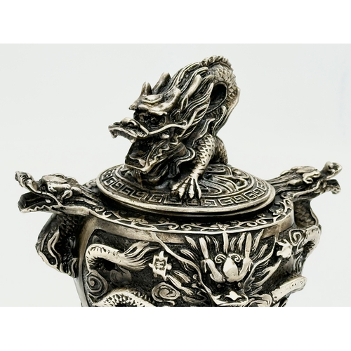 52 - An Early 20th Century Chinese Tibetan ‘9 dragon’ incense burner with cover. Raised on 3 paw feet. Qi... 