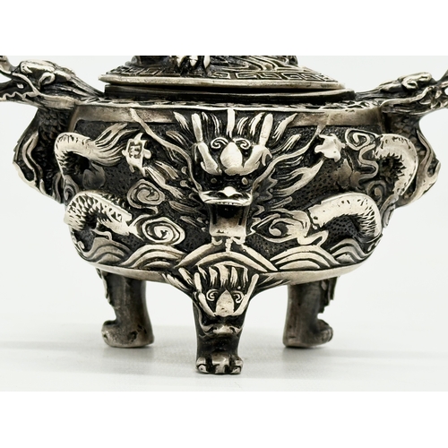 52 - An Early 20th Century Chinese Tibetan ‘9 dragon’ incense burner with cover. Raised on 3 paw feet. Qi... 