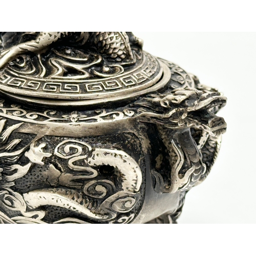 52 - An Early 20th Century Chinese Tibetan ‘9 dragon’ incense burner with cover. Raised on 3 paw feet. Qi... 