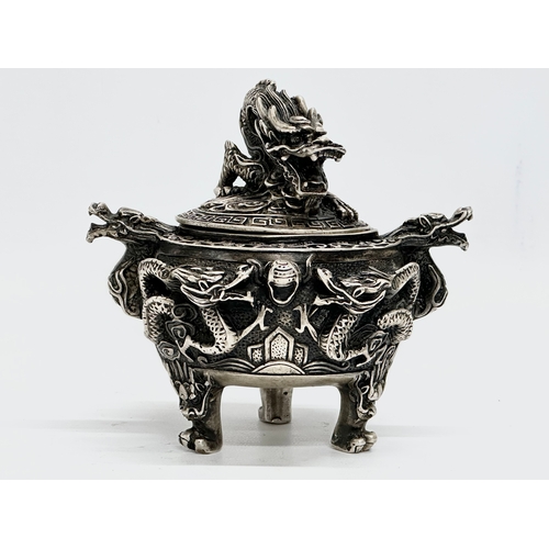 52 - An Early 20th Century Chinese Tibetan ‘9 dragon’ incense burner with cover. Raised on 3 paw feet. Qi... 