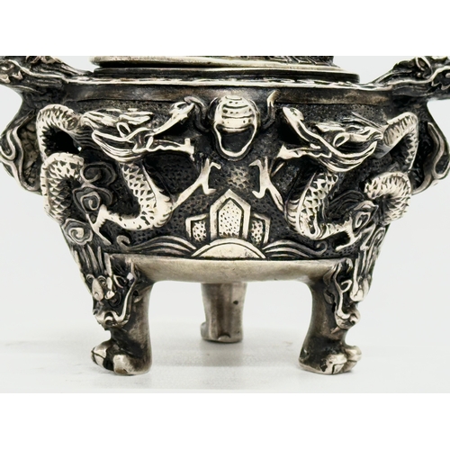 52 - An Early 20th Century Chinese Tibetan ‘9 dragon’ incense burner with cover. Raised on 3 paw feet. Qi... 