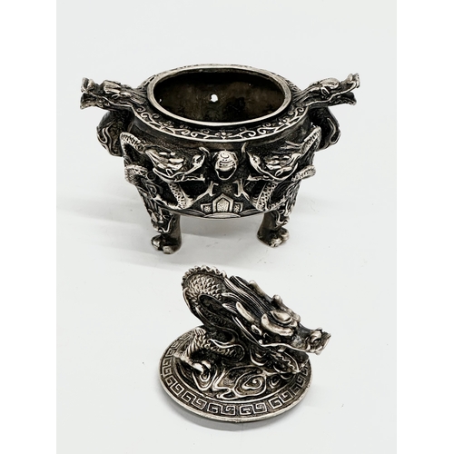 52 - An Early 20th Century Chinese Tibetan ‘9 dragon’ incense burner with cover. Raised on 3 paw feet. Qi... 