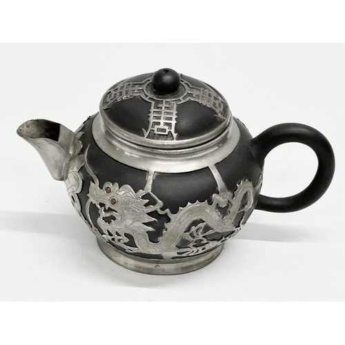 143 - An Early 20th Century Chinese black Yixing, pewter bound teapot with cover. Tung King Shun. 18x11x11... 