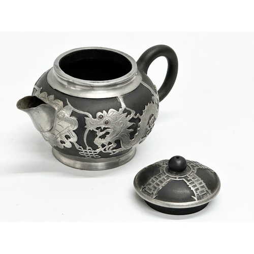 143 - An Early 20th Century Chinese black Yixing, pewter bound teapot with cover. Tung King Shun. 18x11x11... 