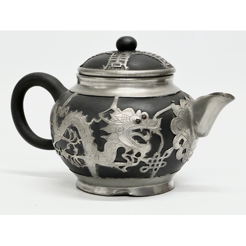 143 - An Early 20th Century Chinese black Yixing, pewter bound teapot with cover. Tung King Shun. 18x11x11... 